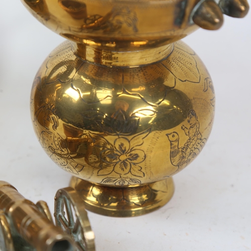 586 - A brass Guernsey milk jug, 18cm, a brass figure, nesting pair of 19th century apothecary's measures ... 