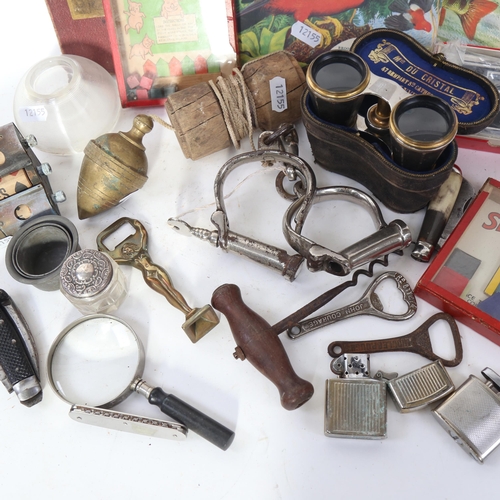 590 - A box of interesting items, including handcuffs, opera glasses, games, Bridge marker etc