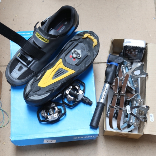 598 - A pair of Shimano gent's cycling shoes, size 48, together with guards and puncture kit