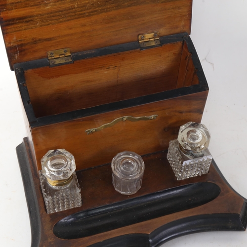 629 - A deskstand with painted and inlaid brass mounts, with 2 cut-glass inkwells, and another glass pot, ... 