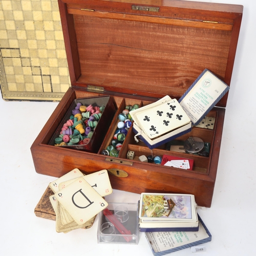 633 - A Victorian mahogany box, containing playing cards, dominos etc, width 33cm