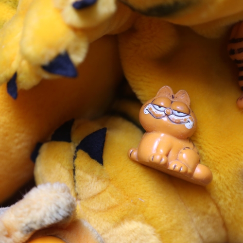 676 - 2 Garfield pyjama cases, and other Garfield figures