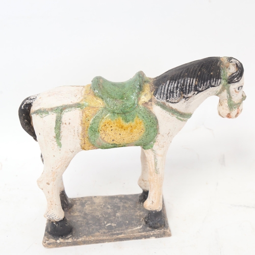 688 - A Tang style painted clay figure of a horse on plinth, height 19.5cm