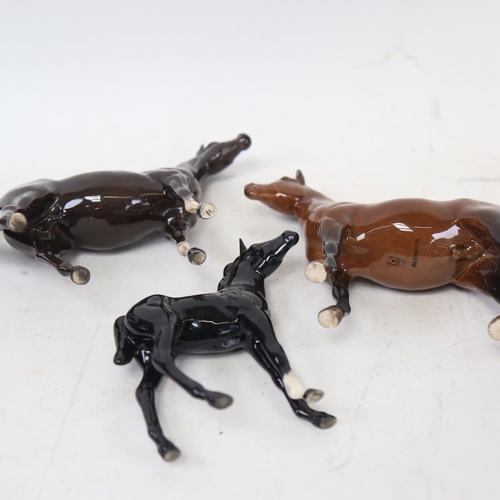 703 - A Beswick black Arab stallion, a Dartmoor pony 1642, and a foal