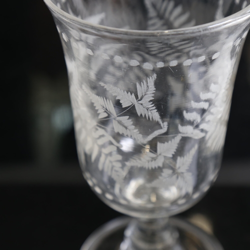 768 - An etched glass celery vase, height 22cm