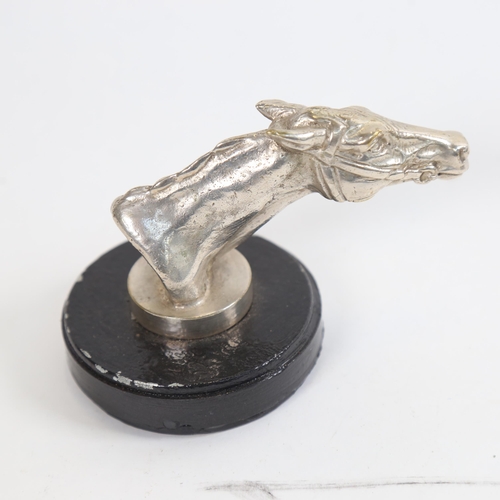 806 - A Vintage silver plated racehorse car mascot, on magnetic base