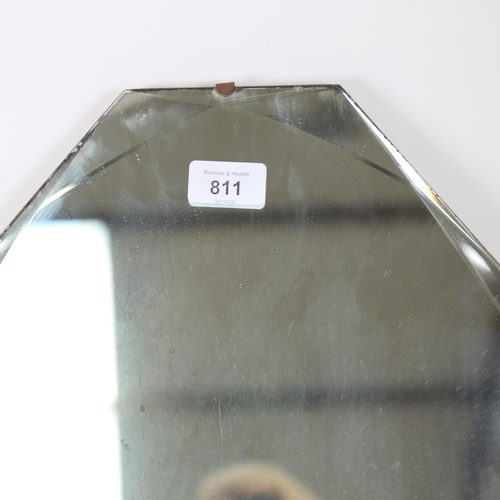 811 - A Vintage shaped bevel-edge wall mirror, 68cm x 41cm