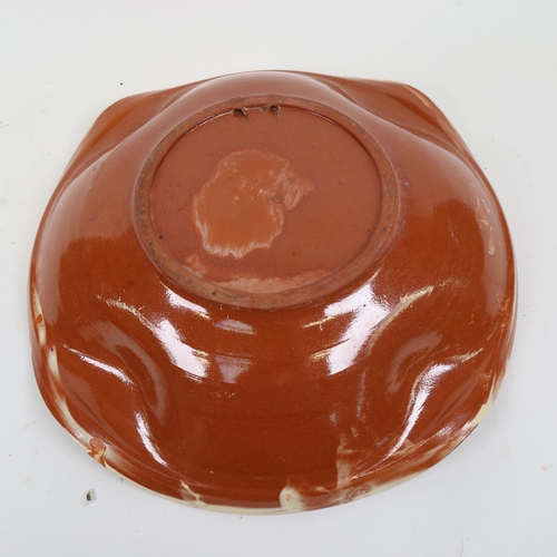 839 - A large terracotta Studio pottery charger, diameter 40cm