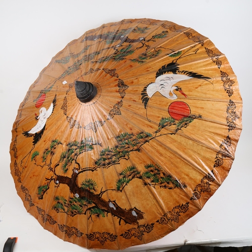 841 - An Oriental parasol, and various hand fans