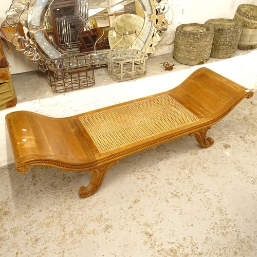 2739 - A scrolled hardwood and cane-seated window seat, on carved legs, L182cm, H50cm, D55cm, seat height 3... 