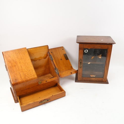 1009 - An oak smoker's cabinet with glazed door, and a desk-top stationery rack with drawer under, height 2... 