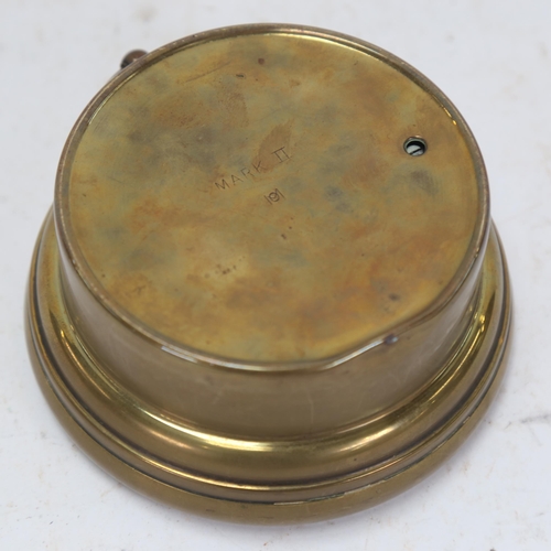 1034 - A brass-cased aneroid barometer, by Reynolds, Son & Wardale, 13cm