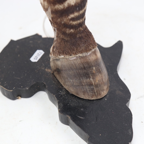 1063 - TAXIDERMY - a zebra's leg and hoof table lamp, height 43cm