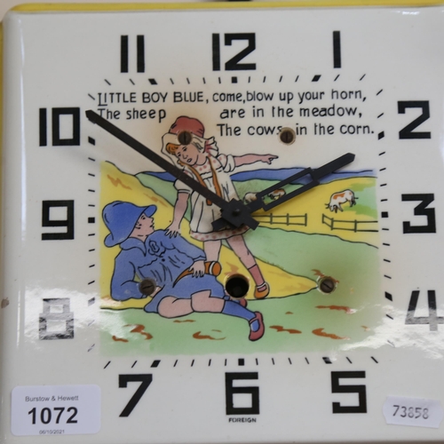 1072 - A ceramic nursery rhyme wall clock, 22cm