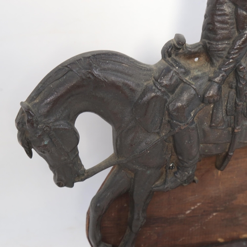 1099 - A cast bronze door stop in the form of a mounted soldier H 34cm