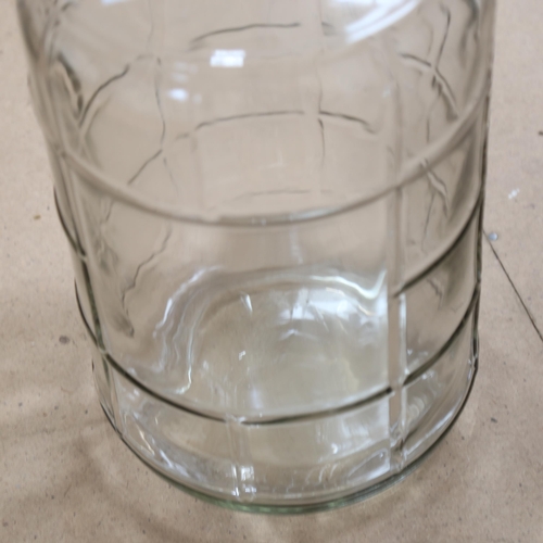 1112 - A large glass demijohn, 56cm