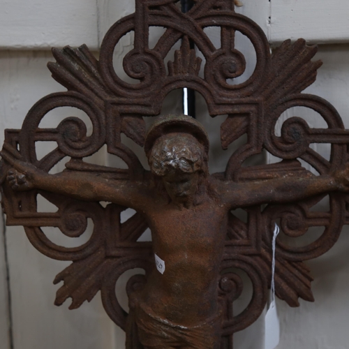 1121 - A large cast-iron crucifix, length 100c (A/F)