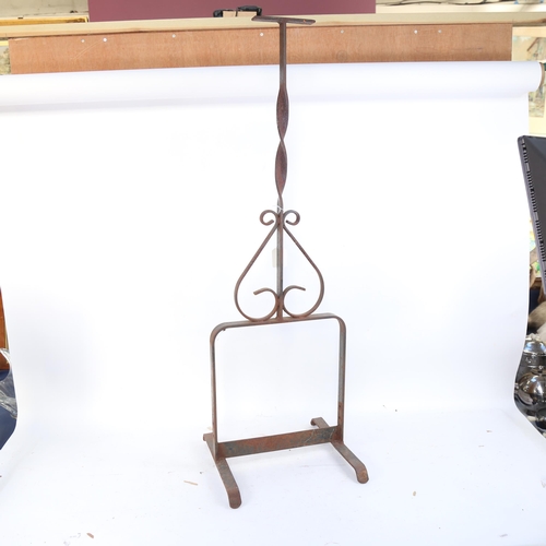 1128 - A wrought-iron boot scraper, height 96cm