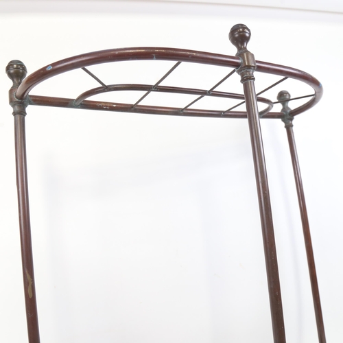 1129 - A Victorian cast-iron and brass-framed stick stand, height 60cm, width 50cm