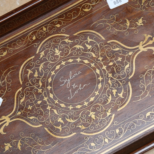 888 - A hardwood tea tray with inlaid brass decoration, length 69cm