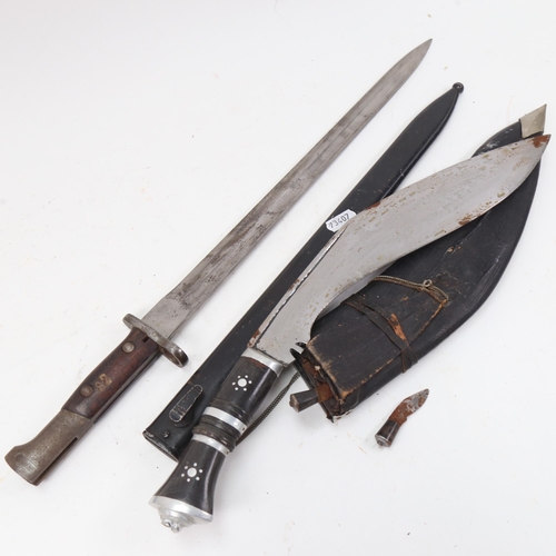 905 - A First World War Period bayonet and scabbard, and an Indian kukri knife (2)