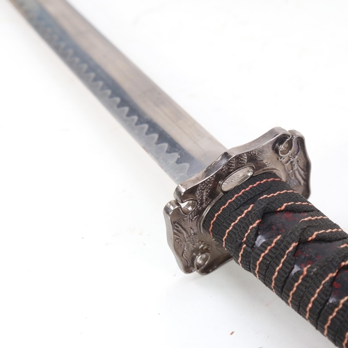 909 - An American made replica katana and scabbard, blade length 66cm