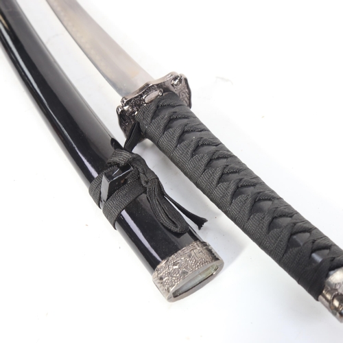 912 - A reproduction Wakizashi sword and scabbard, blade length 50cm