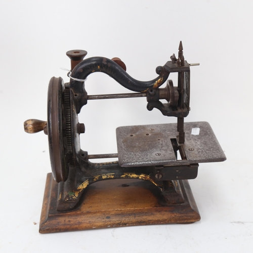 934 - A 19th century Agenoria painted and gilded cast-iron sewing machine by Maxfield & Co Birmingham