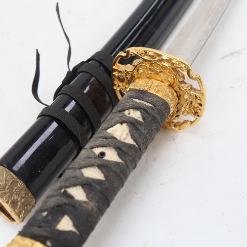 950 - A replica Wakizashi short sword and scabbard, blade length 40cm