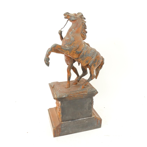 963 - A patinated spelter Marley horse group on plinth, 44cm