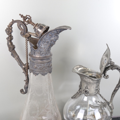 1200 - An Edwardian etched glass Claret jug, with embossed plated mounts, and a hinged stopper with coronet... 