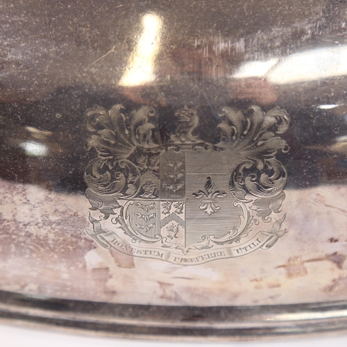 1215 - A silver plated meat cover, with cast acanthus leaf handle, and armorial crest, length 42cm