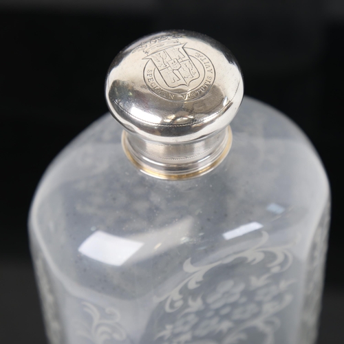 1222 - A Continental etched glass spirit bottle, with silver top and engraved armorial, height 23cm