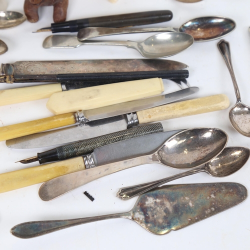 1246 - A box containing various silver teaspoons, plated knives, pipe etc