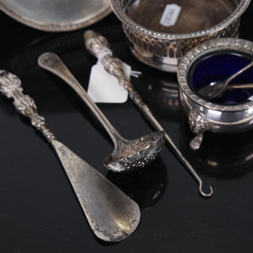 1254 - A silver-handled button hook, and glove stretcher, plated bottle holder, salt etc