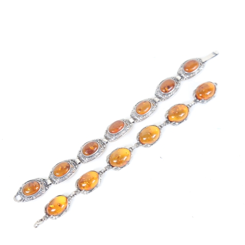 1298 - 2 silver and oval Baltic amber panel bracelets