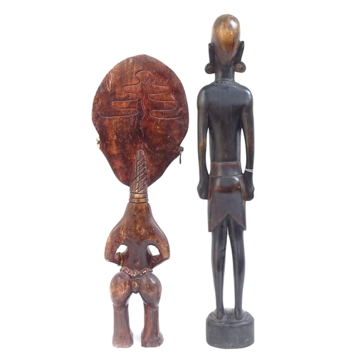 356 - A carved African hardwood figure, 70cm, and a smaller carved wood figure with applied beadwork decor... 