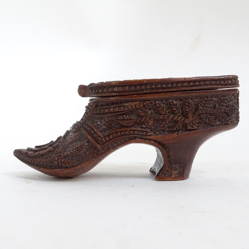 808 - A treen lady's shoe snuffbox, a carved wooden clog, and Grindelwald travelling pocket watch case (3)