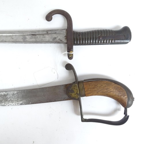 904 - A French 1871 pattern sword bayonet and scabbard, and a Middle Eastern tulwar sword and scabbard (2)