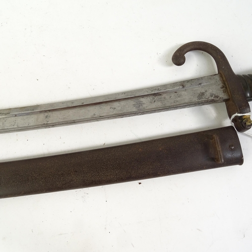 904 - A French 1871 pattern sword bayonet and scabbard, and a Middle Eastern tulwar sword and scabbard (2)