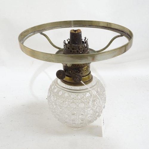 327 - An Antique brass oil lamp with cut-glass font, and another oil lamp with painted decoration, both wi... 