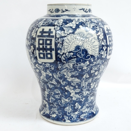 429 - A large Chinese blue and white porcelain baluster jar, with foliate decoration and butterflies, 4 ch... 