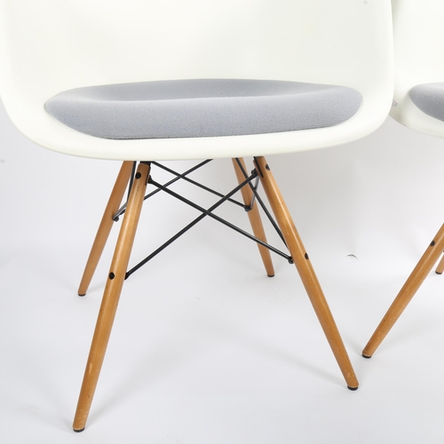 1565 - CHARLES EAMES for Vitra, a pair of DAW armchairs, with white shell and grey padded seat, on maple an... 