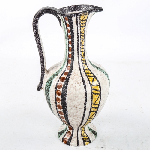 1571 - RUSCHA, Germany, a 1960s pottery jug with decorative striped design, height 20cm