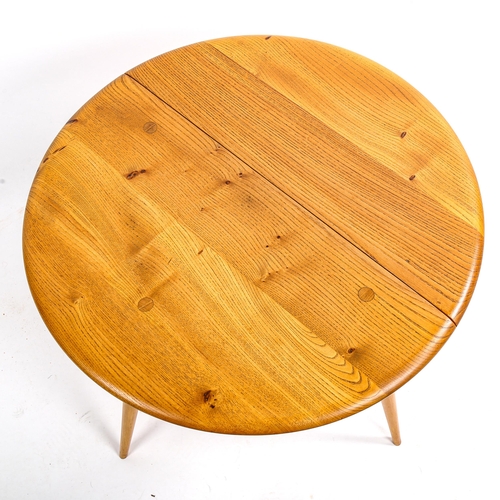 1631 - An ERCOL Windsor drop leaf coffee table in elm and beech, height 40cm