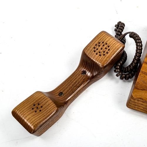 1639 - GFELLER TRUB, A 1970s'/80s' solid elm telephone.