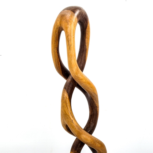 1642 - A mid-century lattice hardwood sculpture, carved signature to base, height 50cm