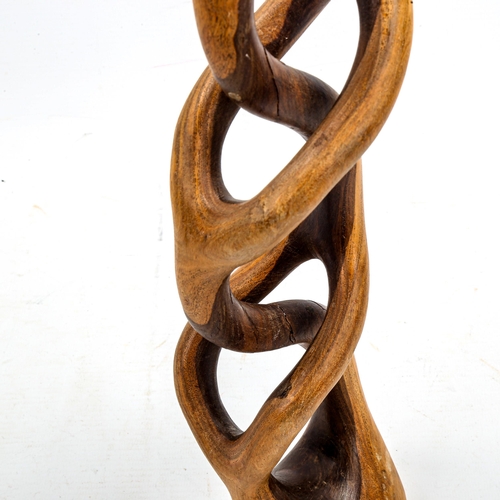 1642 - A mid-century lattice hardwood sculpture, carved signature to base, height 50cm