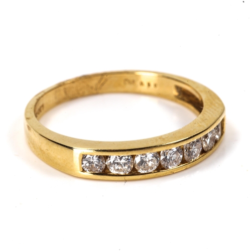 102 - A modern 18ct gold 7-stone diamond half eternity ring, set with modern round brilliant-cut diamonds,... 