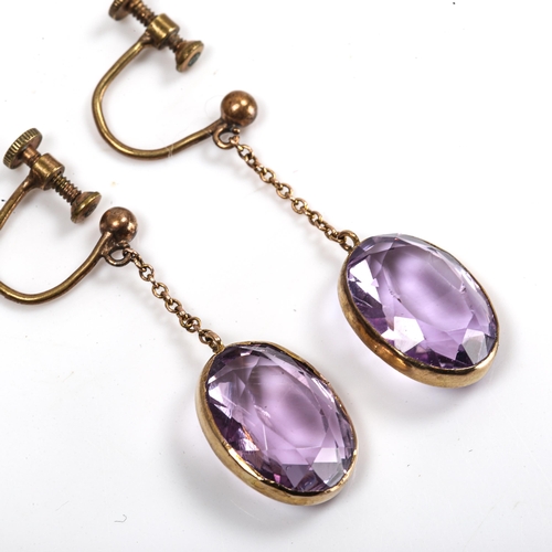 107 - A pair of amethyst drop earrings, gilt-metal settings with oval mixed-cut amethysts, amethysts measu... 